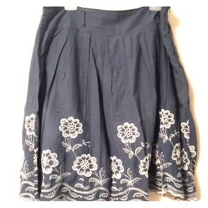 Cute blue skirt with stitched flowers